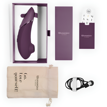 Contenu du coffret du Womanizer Next violet foncé : stimulateur, câble et pochette