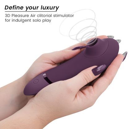 Womanizer Next violet foncé tenu dans la main